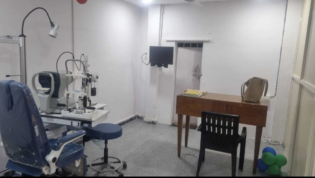Examination room at Vision Eye Clinic with slit lamp, autorefractor and patient chair